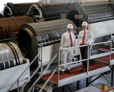 David and Daniel Zartman pose inside Furmano's Foods during one of the team's projects.