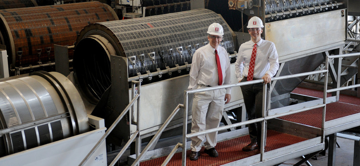 David and Daniel Zartman pose inside Furmano's Foods during one of the team's projects.