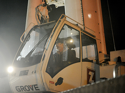 A Zartman Construction crane operator works one of the team