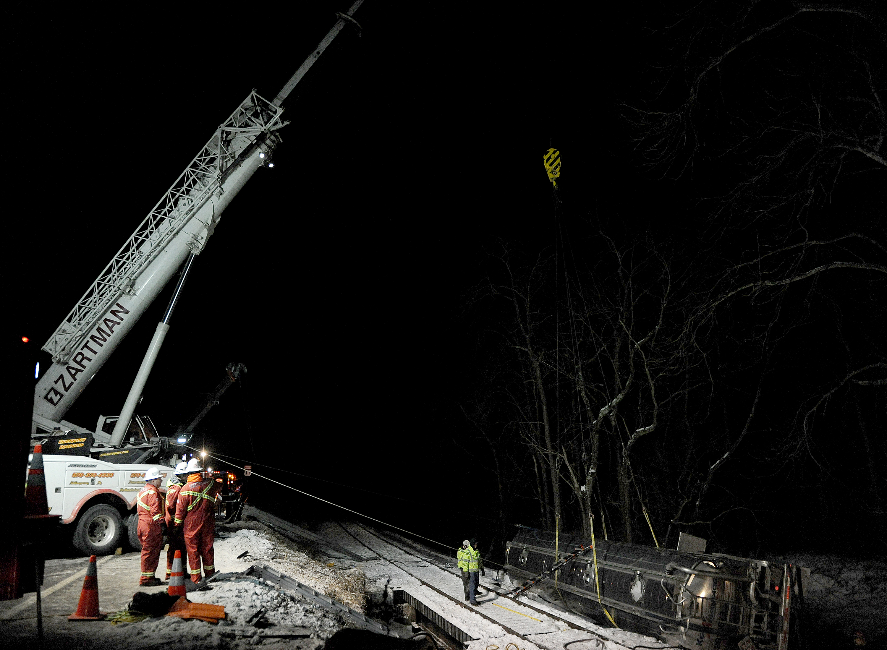 The 225 ton crane is used to stabilize an oil tanker after the tanker rolled off the highway.